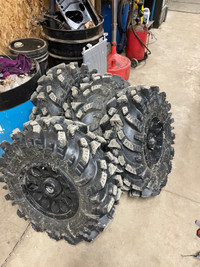 30x10x14 Intimidator mud tires on rims