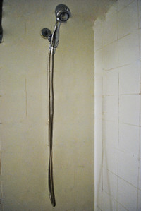 Brand new shower heads with hoses and brackets