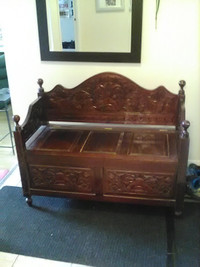 Indoor carved wooden bench with storage compartment