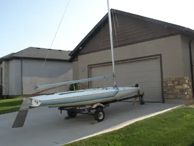 This sailboat is 16 feet long with a beam of 6 feet. This is an older boat but was in storage for a...