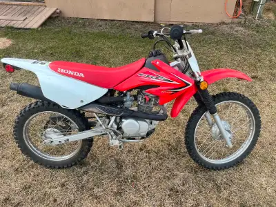 2012 Honda crf100f dirtbike. An adult or a kid can ride this. Driven only a handful of times by my s...