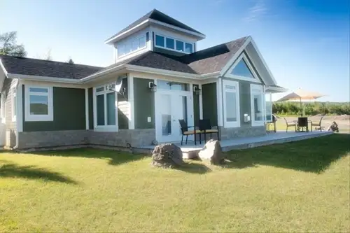 Located on the 2nd hole of the Bell Bay golf course in Baddeck, this house includes 3 bedrooms with...