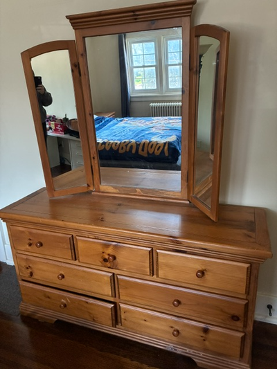 Not particle board. Solid wood, likely Pine as it's relatively light. Price includes dresser, mirror...