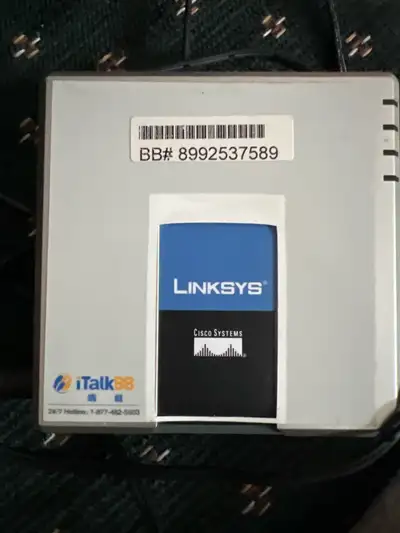 This pre-owned Linksys SPA2102-R Phone Adapter with Router provides reliable VoIP connectivity for y...