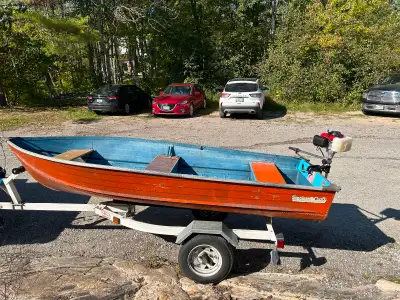 Selling my 12 ft old fishing boat with a new 9.9 hp outboard motor and trailer. Come with 2 oars, ga...