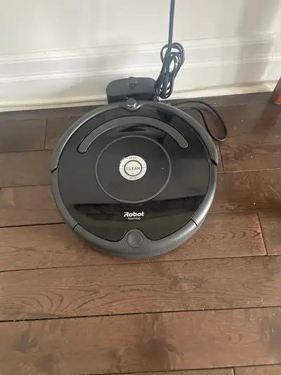 Keep your floors clean with this iRobot Roomba! This used robotic vacuum cleaner is designed to navi...