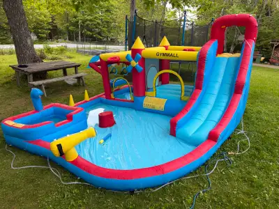 Bouncy castle with waterslide, used once!, View more