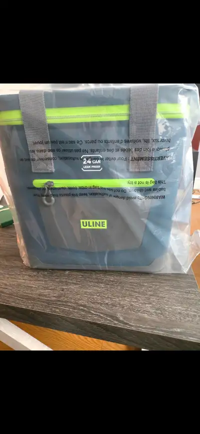 Brand new, still in wrapper, Uline 24 can leakproof cooler.