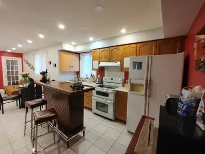 One furnished bedroom with a shared bathroom in a large, very bright, and clean main floor of a male...