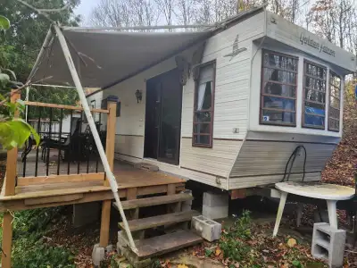 Perfect hunting camp has a full metal roof. Slides need a little work but trailer is solid. $500 Cal...