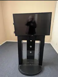 LG Tv and tv stand gaming centre with glass shelves