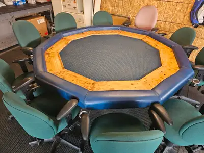 Custom made poker table Seats 10 Comes with 10 office chairs Drink holders Price reduced 500$ or bes...