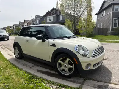 This is a stylish 2010 Mini Cooper, perfect for zipping around town. It has a fuel-efficient engine...