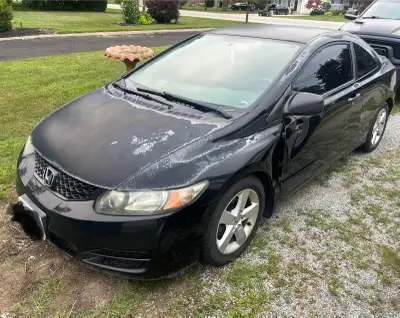 As Is 2010 Honda Civic 2 Door 201,000 kms Runs good No AC Needs a clean, has dings has paint fading....