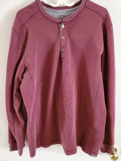 Eddie Bauer henley shirt. This long sleeve top is burgundy with a waffle knit texture. Has a button-...