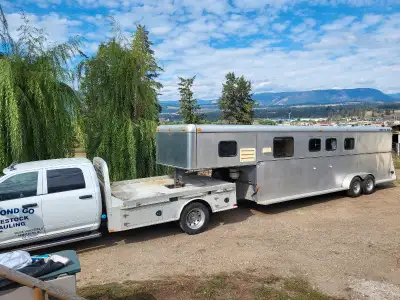 **Located in Armstrong BC ** This trailer was specificly built for 2 horses at the side load and car...