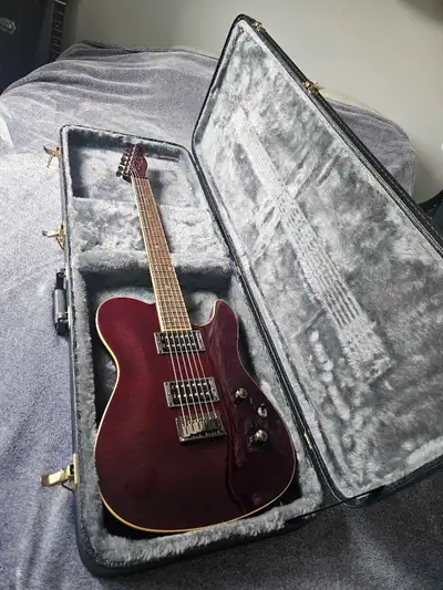 Korean custom telecaster has a setneck and two humbuckers with a push/pull coil tap in tone knob. Or...