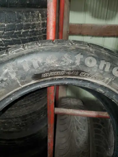 Firestone snow tires 215 55 17 with lots of tread in great condition $200 OBO would trade for 15 inc...