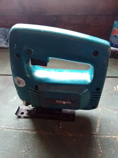 I'm selling a Makita 4320 Jig Saw, perfect for detailed cuts in various materials. The saw is in use...