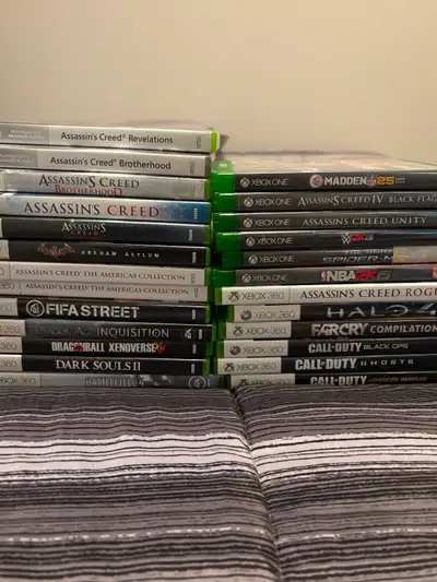 Multiple X box 360 and X box one games along with 2 360 paddles one of which wireless and headset. $...