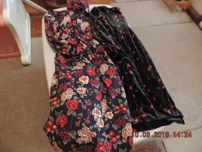 Both of these beautiful dresses are in excellent condition with no rips or stains. One dress is Pier...