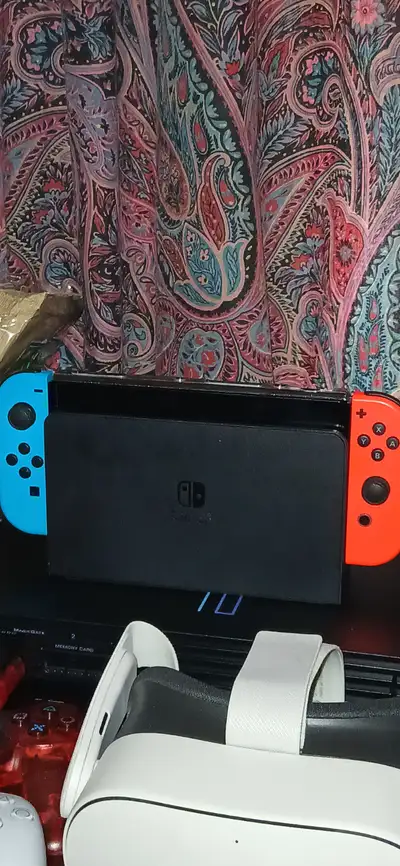 Nintendo Switch OLED with 4 games + bundle, View more