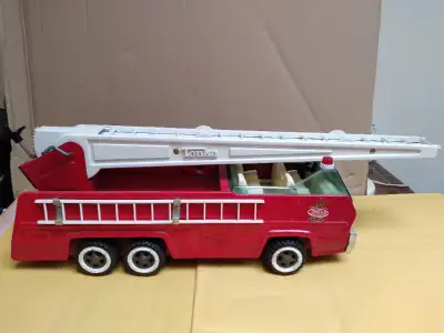 This is the Rare Vintage Tonka Red Ladder Fire Truck. It is a rare Tonka truck manufactured in the S...