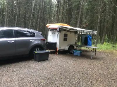 4 x 6-foot White Enclosed Avenger Competitor trailer (Model C46SA2200), modified for camping. Bear-p...