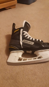 2 pairs of Hockey skates & helmet