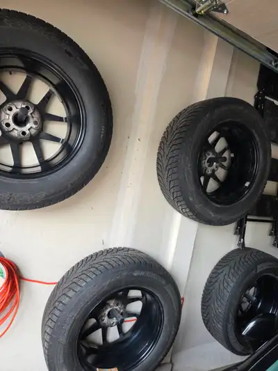 Set of 4 Hankook Winter Tires mounted on black rims. Used lightly for only 2 winter seasons. In exce...