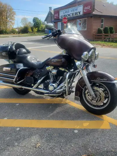 130,000 kms dark red with black bags and box ! 88 cubic inch motor with lots of life and does not le...