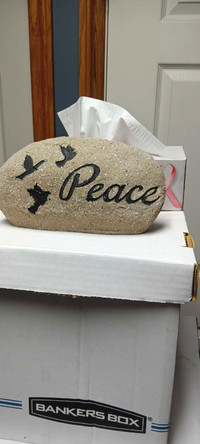 Light weight rock that says peace 