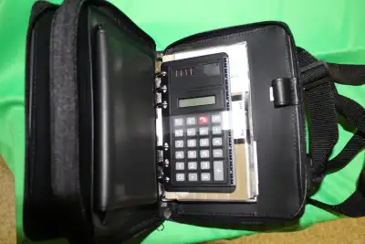 Deluxe electronic organizer, calculator all in original box, View more