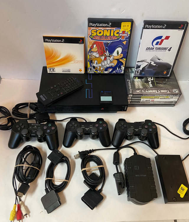 PS2 console + 3 controllers + 7 games + more!! in Older Generation in Winnipeg