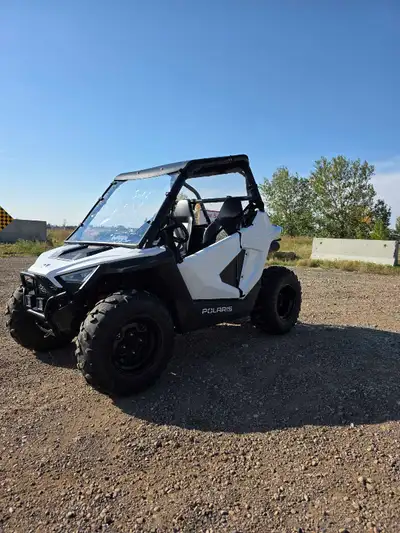 I have my daughter's 2023 RZR 200 up for sale. 550km. Has roof and front and back windows, led cubes...