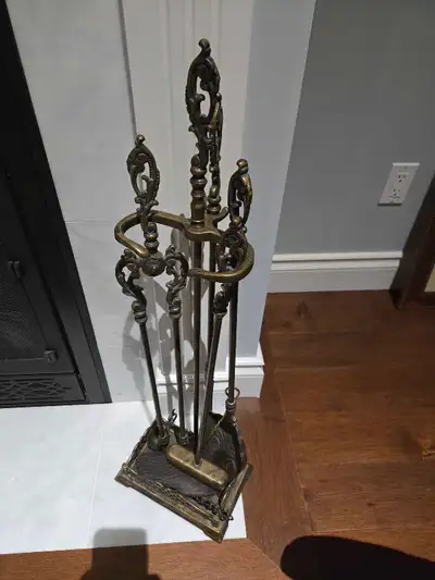 Fireplace poker set was used for display at a natural gas fireplace.