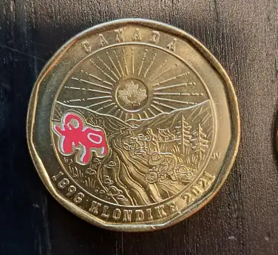 2 1-DOLLAR COINS, View more