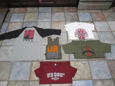 Up for sale is a five piece lot of Highly Collectible U2 T-shirts in Like New Condition. Part of an...