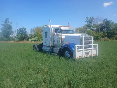 2005 KW W900L; recently installed pre-emissions 2005 Detroit 60 series, 550HP with only 300,000 KMs...