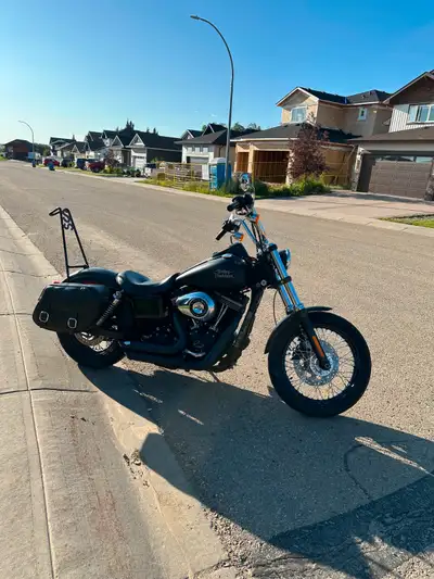 Well-maintained Dyna Street Bob with a matte finish and key upgrades: Vance & Hines pipes Screamin’...