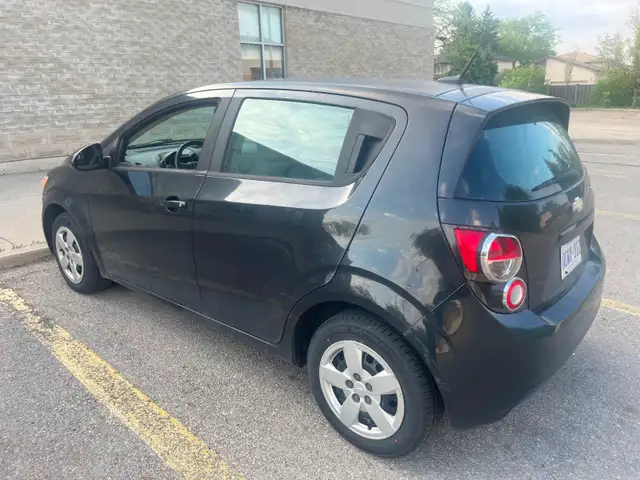 2014 Chevy Sonic base/ manual 5 speed $1000obo Or trade for ATV in Cars & Trucks in St. Catharines - Image 4