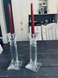 Two beautiful candle holders including candles 