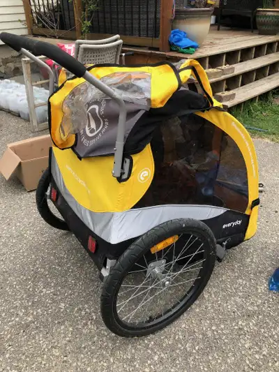 Everyday Bike Trailer available. Seat harnesses for two kids. Includes a front wheel to convert to p...