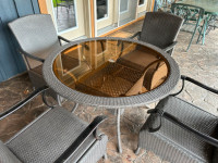FOUR PIECE WICKER TABLE with FOUR MATCHING CHAIRS