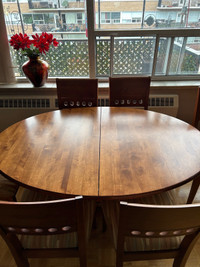 Beautiful wood table with matching chairs and hutch