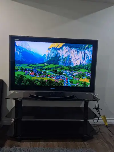 46" Toshiba Regza TV and Premium Glass TV stand, View more