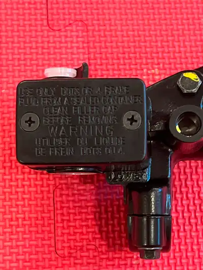 New Kawasaki Genuine Parts front brake lever & brake master cylinder complete with brake light switc...