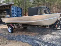 Aluminium boat motor and trailer.