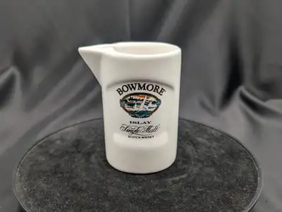 A Bowmore Islay Whisky Water Jug or Pourer. It is a ceramic pitcher or water jug featuring the Bowmo...