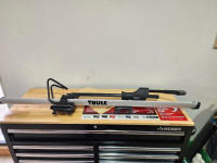 2 - Thule roof top bike carriers for sale. 